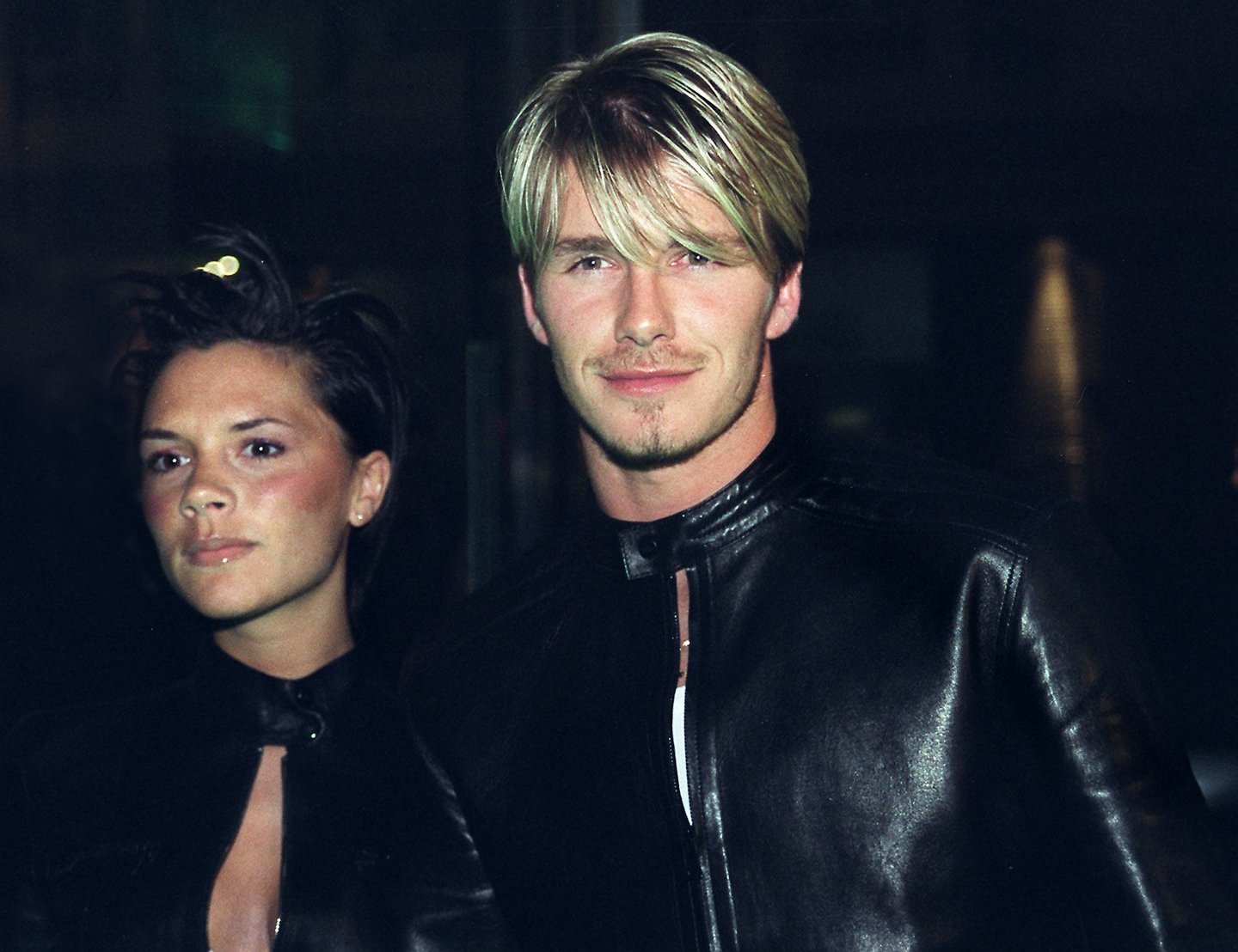 Spice Girls Victoria Adams (L) arrives with her husband, Manchester United and England star David Beckham (R), to a Versace star-studded reception hosted by Donatella Versace in London late Friday 11 June 1999. The reception comes after the Versace "Diamonds are forever" charity fashion event 09 June which raised funds for three charities including the Prince's Foundation for architecture and the environment. (Photo credit should read SINEAD LYNCH/AFP/Getty Images)