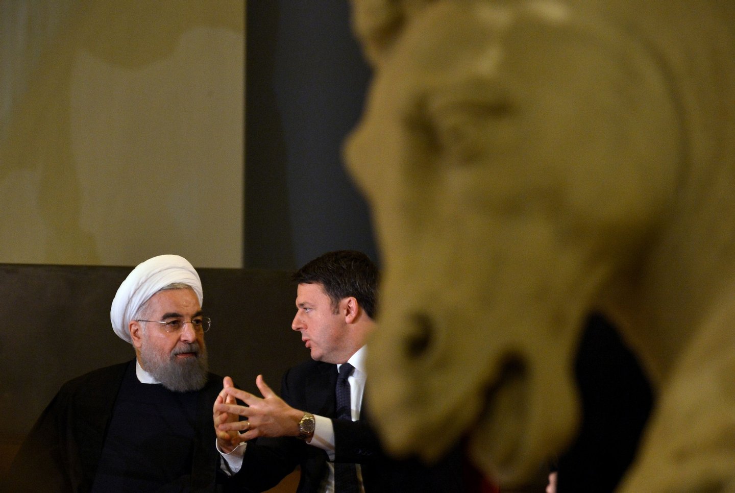 Italian Prime Minister Matteo Renzi (R) speaks with Iranian President Hassan Rouhani (L) during a meeting at the Capitol Hill in Rome on January 25, 2016. Iran's return to the international fold accelerated as Rouhani sealed multi-billion dollar deals with Italian companies keen to capitalise on the lifting of sanctions on the Islamic Republic. / AFP / TIZIANA FABI (Photo credit should read TIZIANA FABI/AFP/Getty Images)