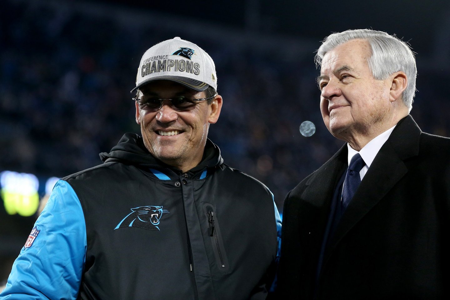 CHARLOTTE, NC - JANUARY 24: (L-R) Head coach Ron Rivera and owner Jerry Richardson of the Carolina Panthers smile after defeating the Arizona Cardinals with a score of 49 to 15 in the NFC Championship Game at Bank of America Stadium on January 24, 2016 in Charlotte, North Carolina. (Photo by Streeter Lecka/Getty Images)