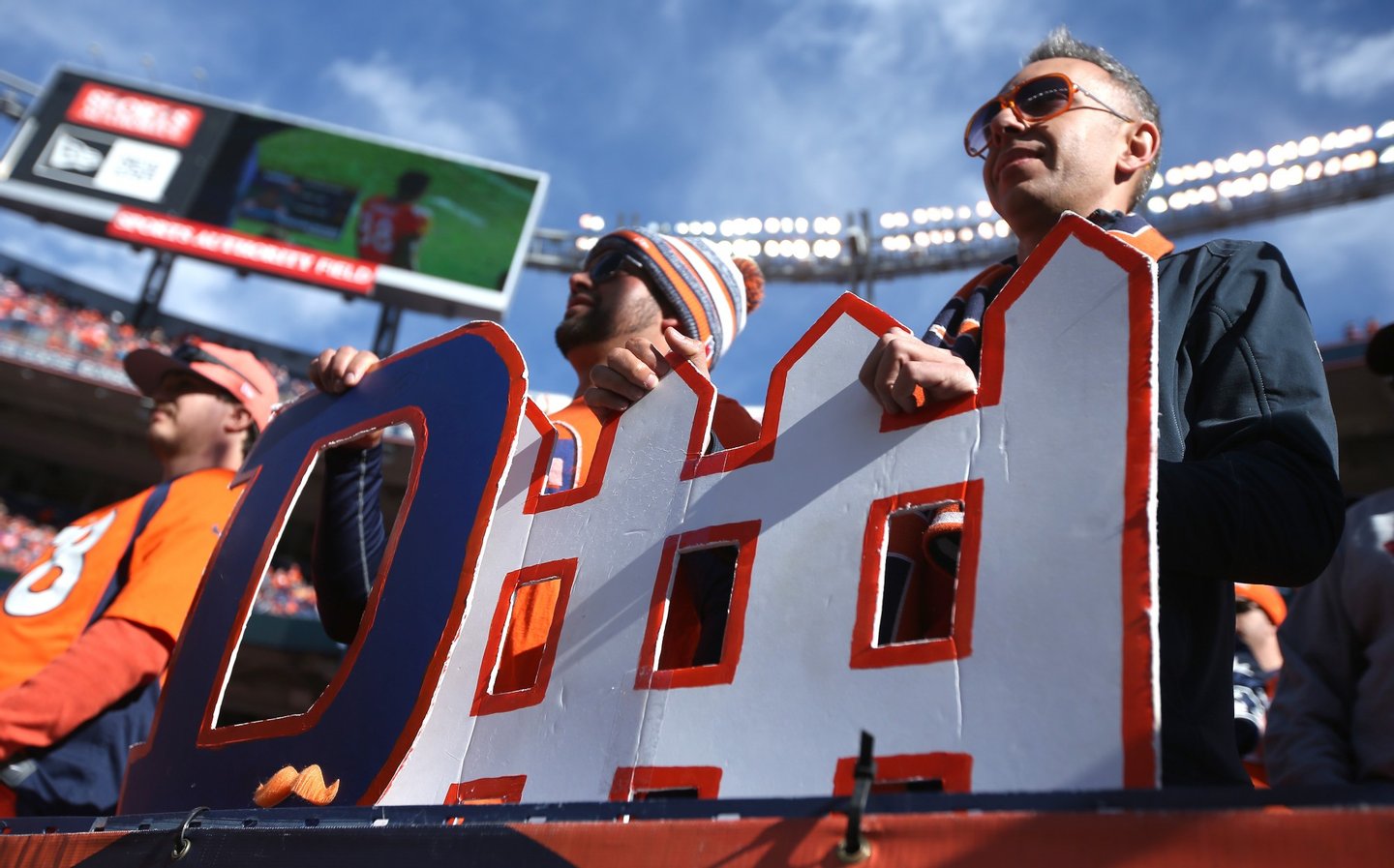 DENVER, CO - JANUARY 24: Fans hold a 'defense' sign prior to the AFC Championship game between the New England Patriots and the Denver Broncos at Sports Authority Field at Mile High on January 24, 2016 in Denver, Colorado. (Photo by Doug Pensinger/Getty Images)