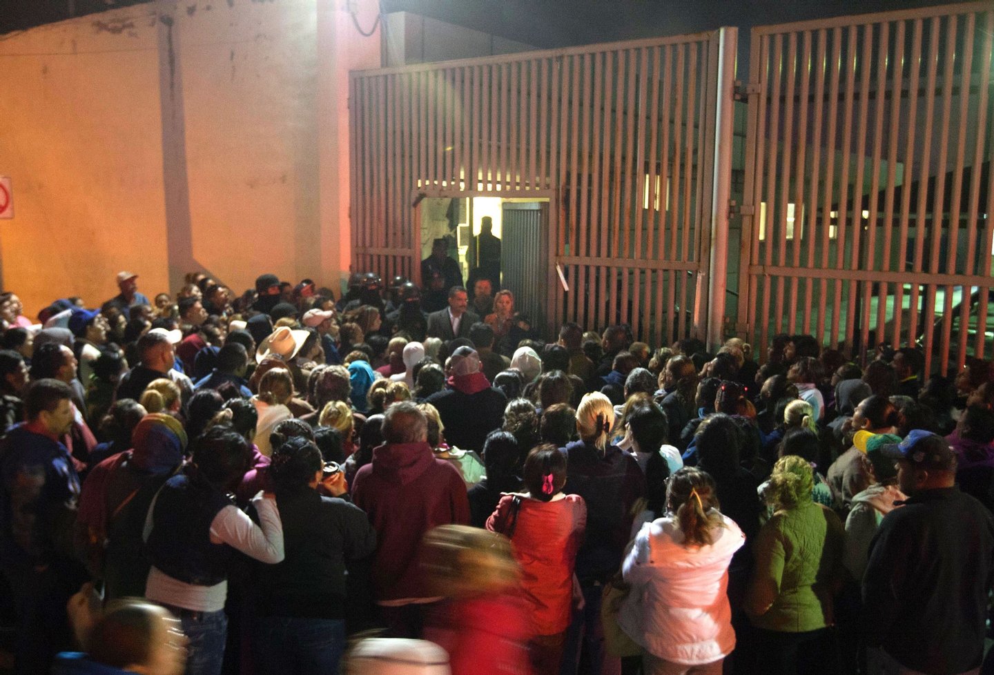 Relatives of inmates gather outside the Topo Chico prison in the northern city of Monterrey in Mexico where according to local media at least 30 people died in a prison riot on February 11, 2016. Riot police and ambulances were deployed at the Topo Chico prison as smoke billowed from the facility. Broadcaster Televisa reported that 30 died while Milenio television spoke of 50 victims, with inmates and prison guards among them. AFP PHOTO / JULIO CESAR AGUILAR / AFP / Julio Cesar Aguilar (Photo credit should read JULIO CESAR AGUILAR/AFP/Getty Images)