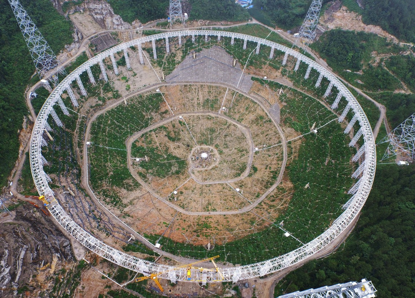 This picture taken on July 29, 2015 shows the five-hundred-metre Aperture Spherical Radio Telescope (FAST) under construction in Pingtang, southwest China's Guizhou province. China has started assembling the world's largest radio telescope, which will have a dish the size of 30 football pitches when completed, state media reported as Beijing steps up its ambitions in outer space. CHINA OUT AFP PHOTO (Photo credit should read STR/AFP/Getty Images)