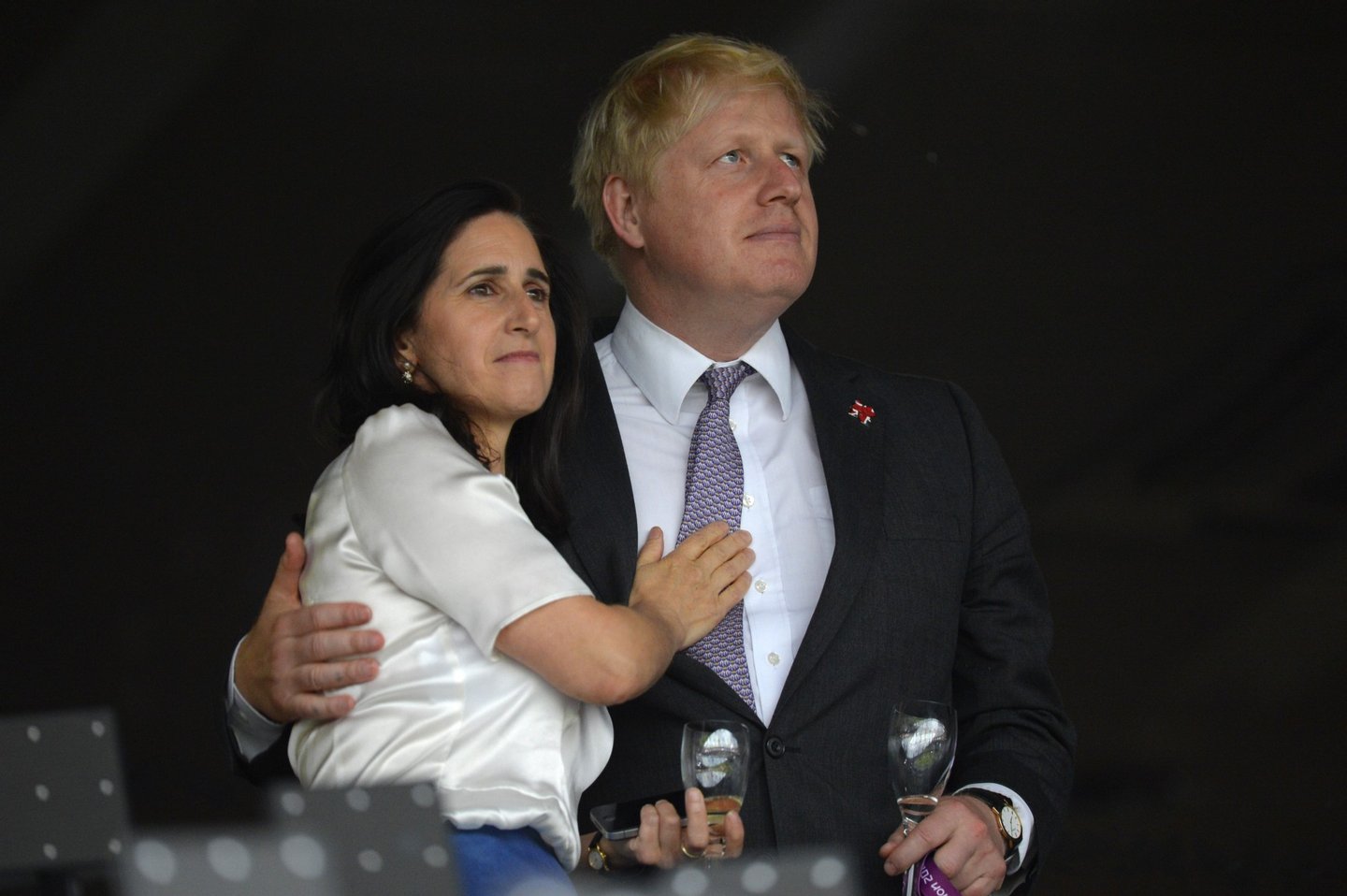 London's Mayor Boris Johnson (R) waits with his wife Marina Wheeler (L) prior to the start of the opening ceremony of the London 2012 Olympic Games on July 27, 2012 at the Olympic Stadium in London. AFP PHOTO / ODD ANDERSEN (Photo credit should read /AFP/GettyImages)