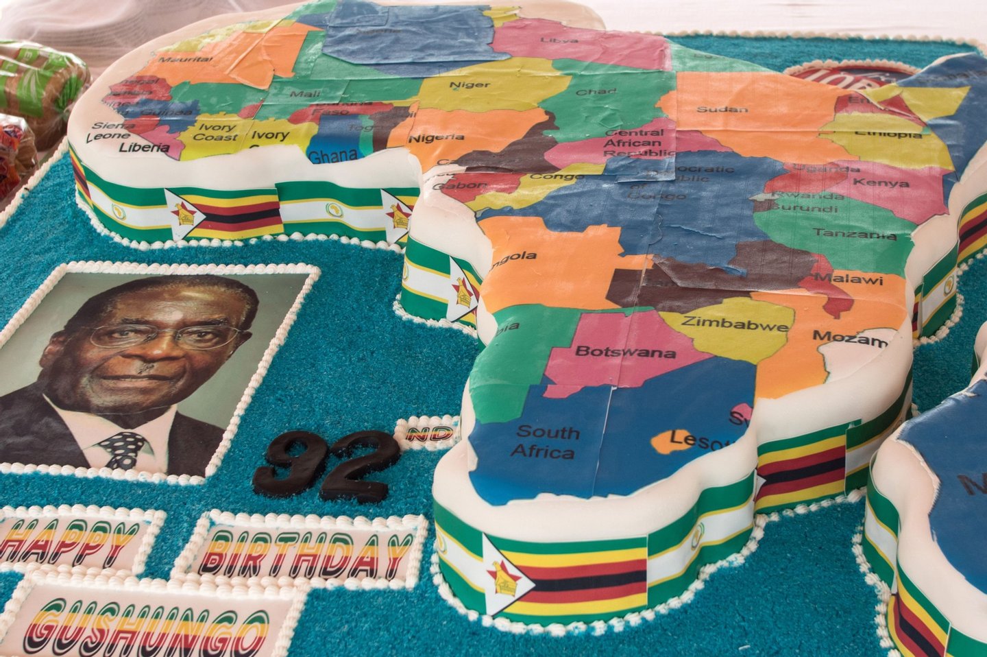 A picture shows Zimbabwean President Robert Mugabe's birthday cake in the shape of the map of Africa during celebrations marking his birthday at the Great Zimbabwe monument in Masvingo on February 27, 2016. / AFP / JEKESAI NJIKIZANA (Photo credit should read JEKESAI NJIKIZANA/AFP/Getty Images)