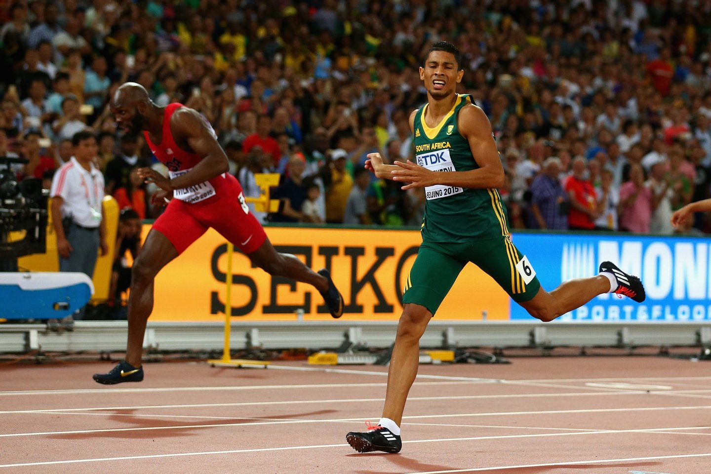 BEIJING, CHINA - AUGUST 26: Wayde Van Niekerk of South Africa (R) crosses the finish line to win gold ahead of Lashawn Merritt of the United States (L) in the Men's 400 metres final during day five of the 15th IAAF World Athletics Championships Beijing 2015 at Beijing National Stadium on August 26, 2015 in Beijing, China. (Photo by Cameron Spencer/Getty Images)