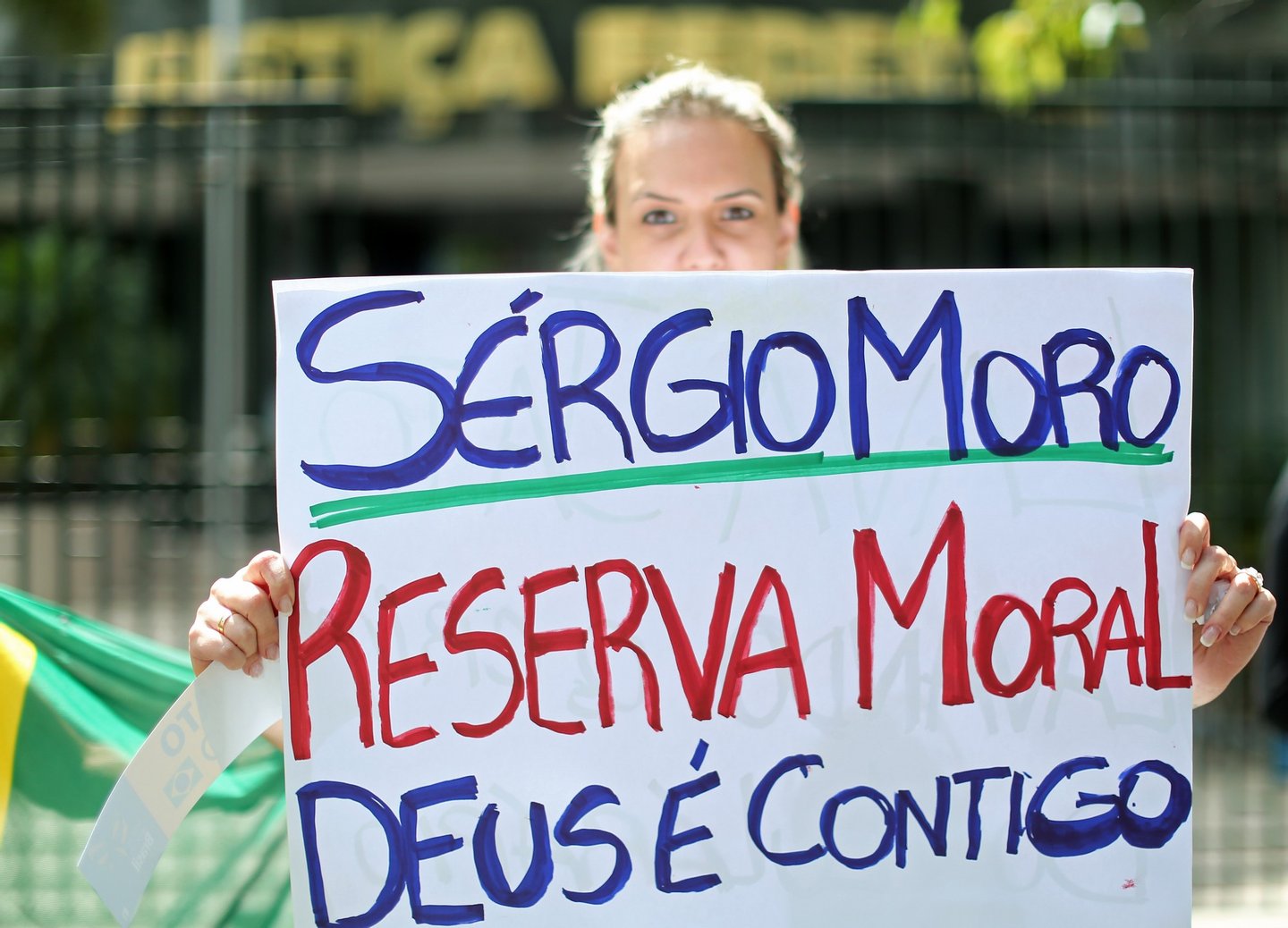 A demonstrator protests against corruption in front of the Federal Justice Palace in Curitiba, Brazil on March 17, 2016. Brazil's former president Luiz Inacio Lula da Silva was sworn in Thursday as chief of staff to his embattled successor Dilma Rousseff amid angry protests from opponents who accuse him of trying to dodge corruption charges. Lula took office in a tumultuous scene at the presidential palace, where a protester shouted "Shame!" and the ex-president's supporters chanted slogans accusing their opponents of seeking a "coup". However hours after Lula's appointment, federal judge Sergio Moro, who is heading a probe into the Petrobras scandal, ordered the release of a call recorded by police suggesting darker motives. AFP PHOTO / HEULER ANDREY / AFP / Heuler Andrey (Photo credit should read HEULER ANDREY/AFP/Getty Images)