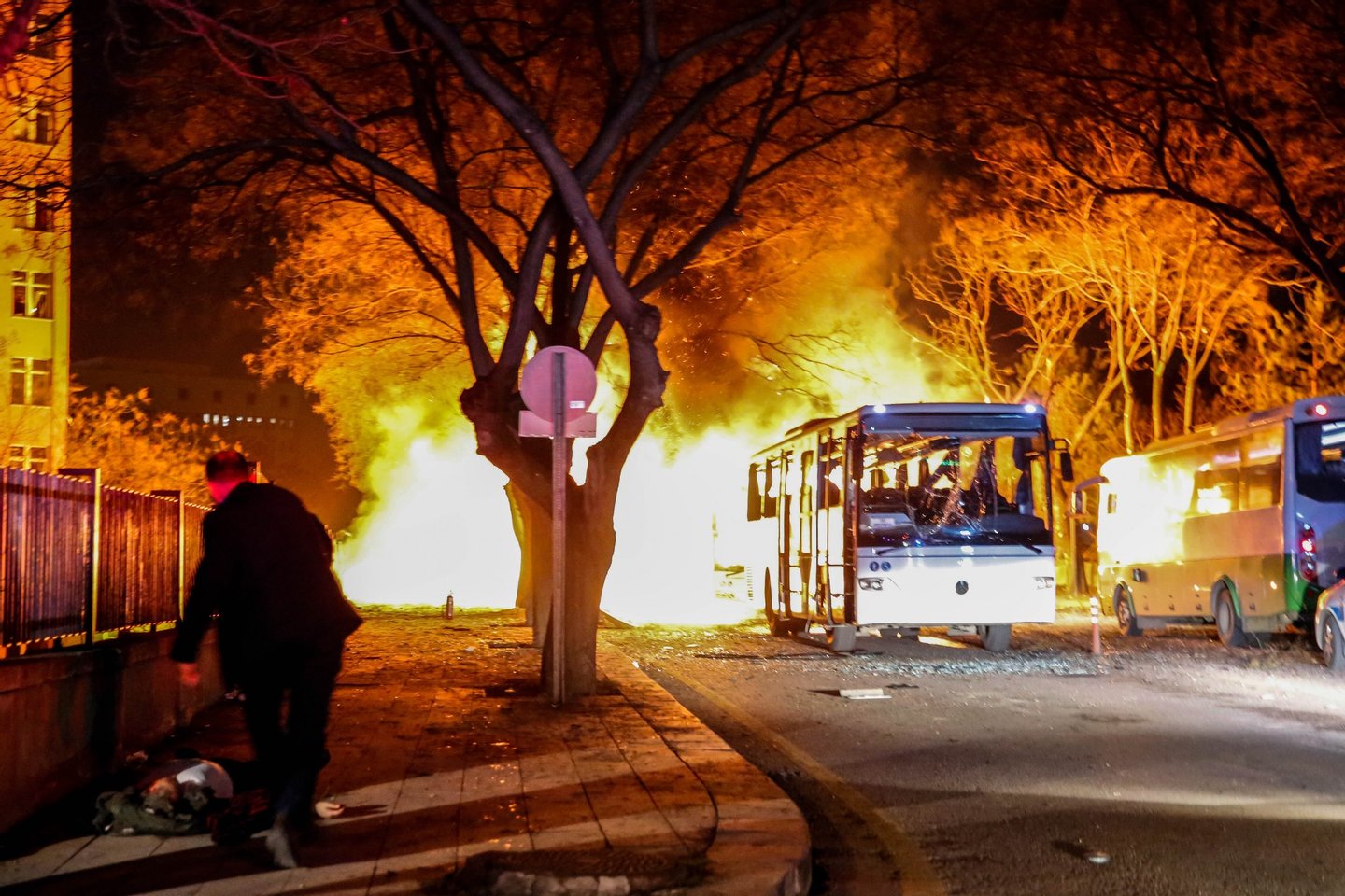ANKARA, TURKEY - FEBRUARY 17: Turkish army service busses burn after an explosion on February 17, 2016 in Ankara, Turkey. 21 people are believed to have been killed and at least 61 are said to be wounded according to the city's governor Mehmet Kiliclar in what appeared to have been a car bomb attack on a vehicle carrying military personnel in the Turkish capital. (Photo by Defne Karadeniz/Getty Images)