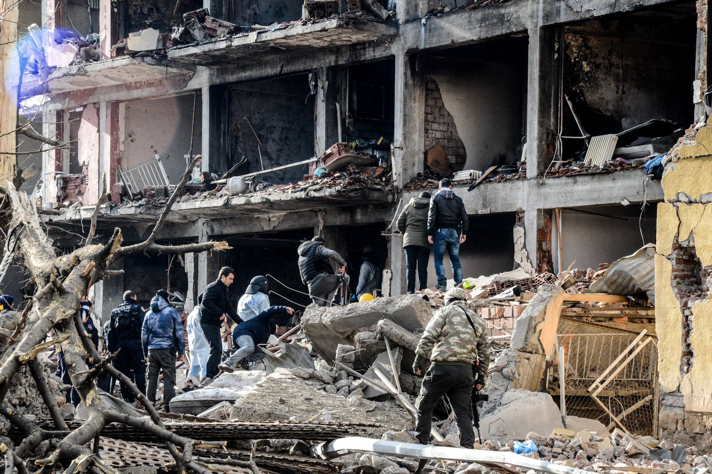 Turkish police search through the wreckage of a blast damaged building on January 14, 2016 in Diyarbakir. Six people died and 39 others were wounded in a car bomb attack blamed on Kurdish rebels that ripped through a police station and an adjacent housing complex for officers and their families in southeastern Turkey, security forces said Thursday, updating an earlier toll of five. / AFP / ILYAS AKENGIN        (Photo credit should read ILYAS AKENGIN/AFP/Getty Images)