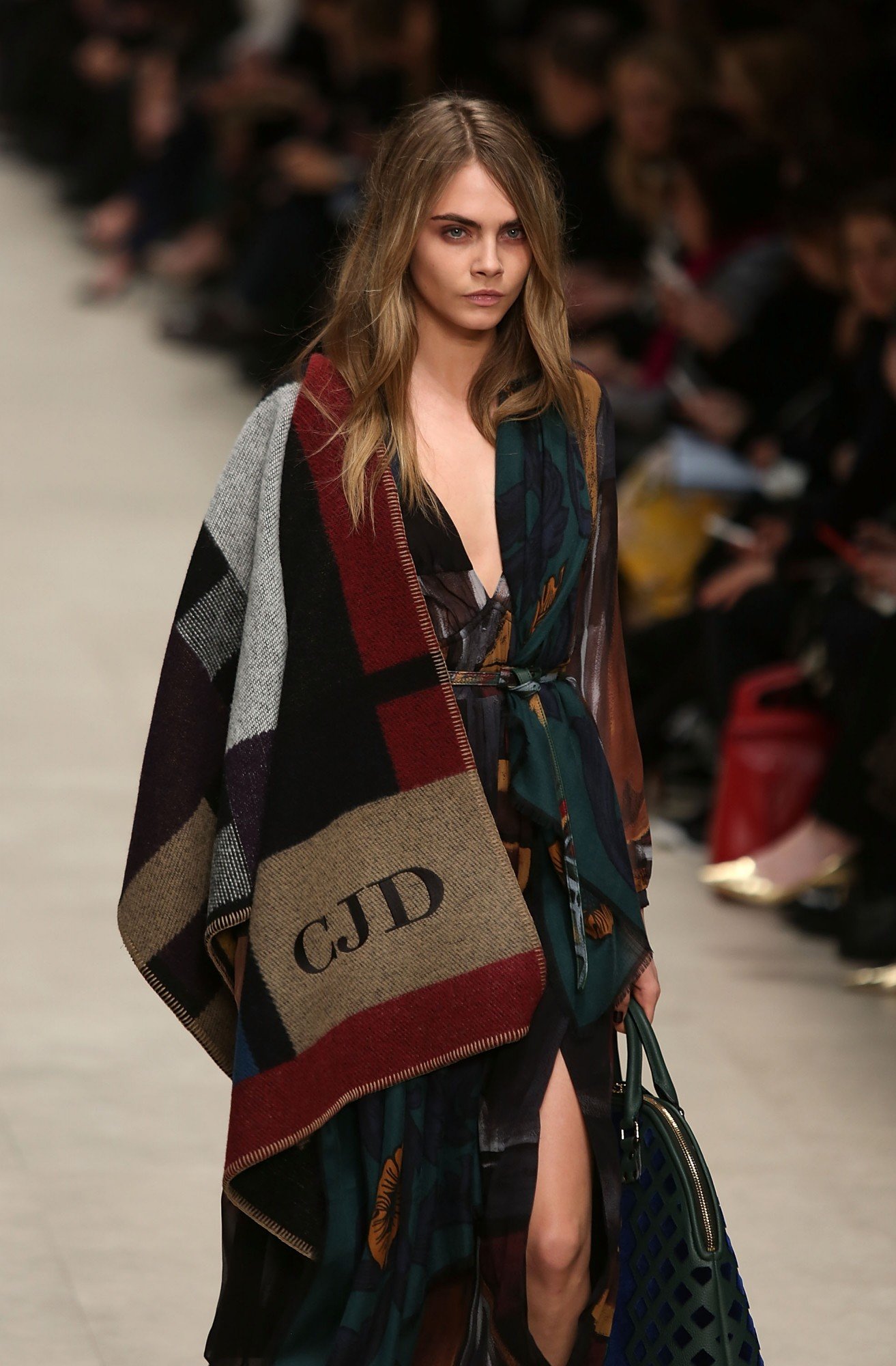 LONDON, ENGLAND - FEBRUARY 17: Model Cara Delevingne walks the runway at the Burberry Prorsum show at London Fashion Week AW14 at Perks Fields, Kensington Gardens on February 17, 2014 in London, England. (Photo by Tim P. Whitby/Getty Images)