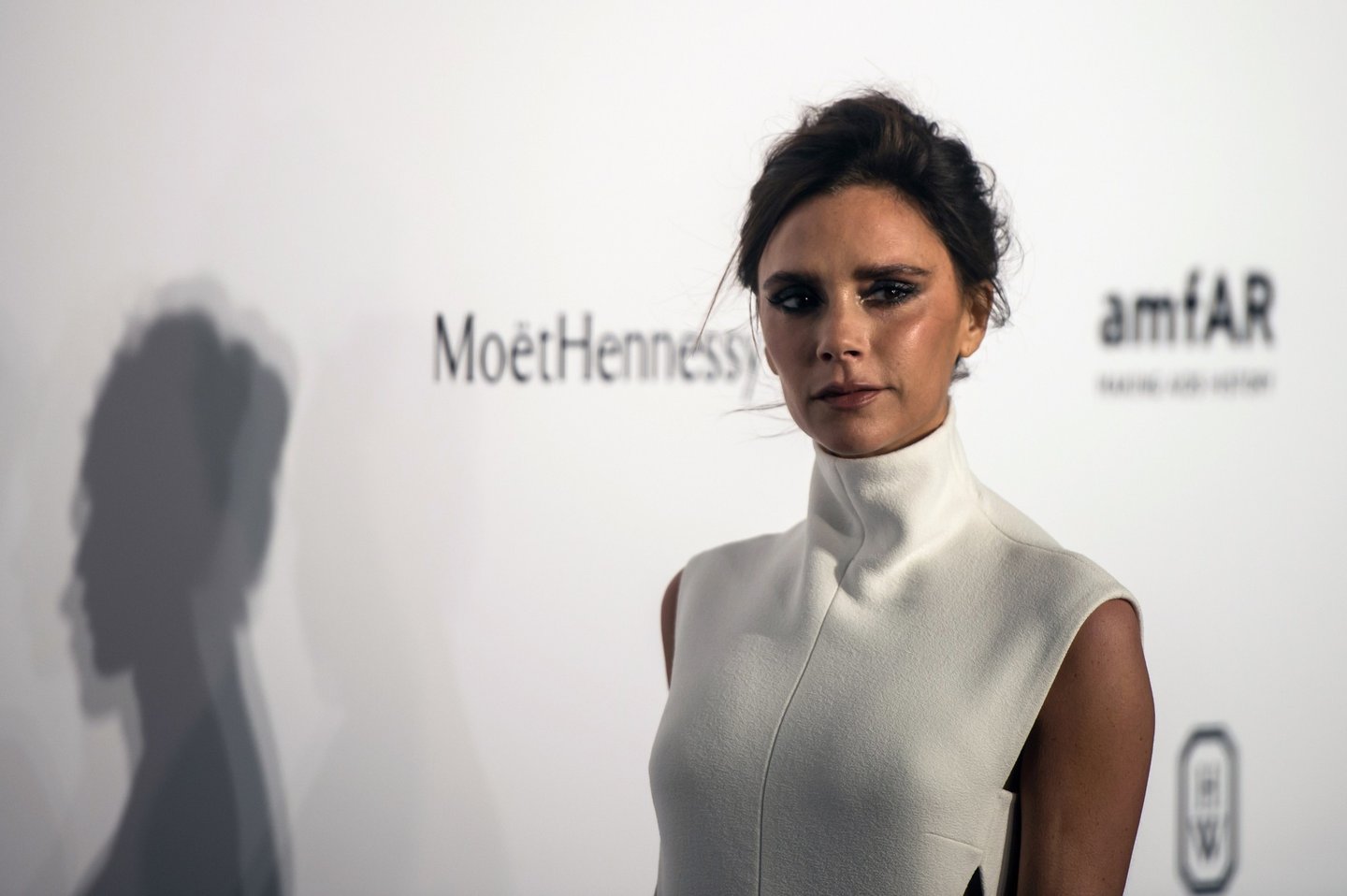 British fashion designer and singer Victoria Beckham poses as she arrives on the red carpet during the 2015 amfAR Hong Kong gala at Shaw Studios in Hong Kong on March 14, 2015. amfAR, The Foundation for AIDS Research, held its inaugural fundraising gala in Hong Kong on March 14. AFP PHOTO / ANTHONY WALLACE (Photo credit should read ANTHONY WALLACE/AFP/Getty Images)