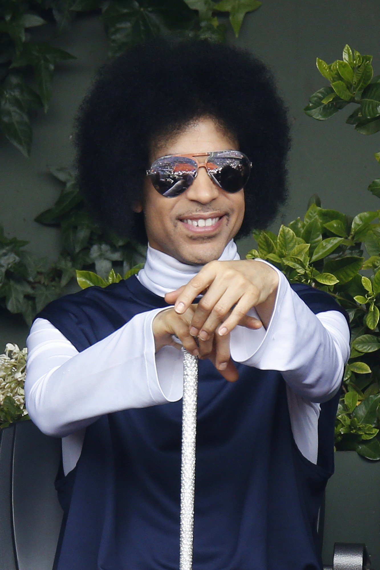 US singer Prince attends the French tennis Open round of sixteen match between Spain's Rafael Nadal and Serbia's Dusan Lajovic at the Roland Garros stadium in Paris on June 2, 2014. AFP PHOTO / KENZO TRIBOUILLARD (Photo credit should read KENZO TRIBOUILLARD/AFP/Getty Images)