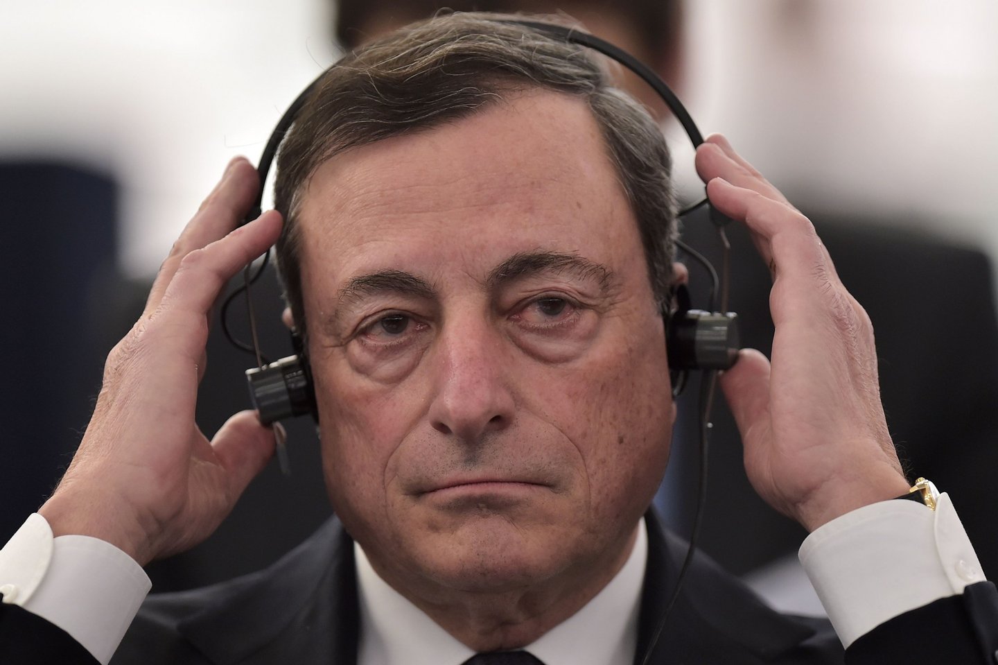 President of the European Central Bank (ECB) Mario Draghi adjusts his headphones as he attends a debate at the European Parliament in Strasbourg, eastern France, on February 1, 2016. / AFP / PATRICK HERTZOG (Photo credit should read PATRICK HERTZOG/AFP/Getty Images)