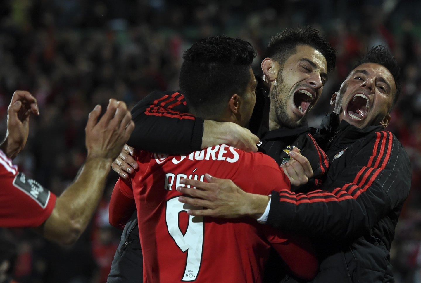 Benfica's Mexican forward Raul Jimenez (L) celebrates with teammates after scoring a goal during the Portuguese league football match Rio Ave FC vs SL Benfica at the Dos Arcos stadium in Vila do Conde on April 24, 2016. / AFP / FRANCISCO LEONG (Photo credit should read FRANCISCO LEONG/AFP/Getty Images)