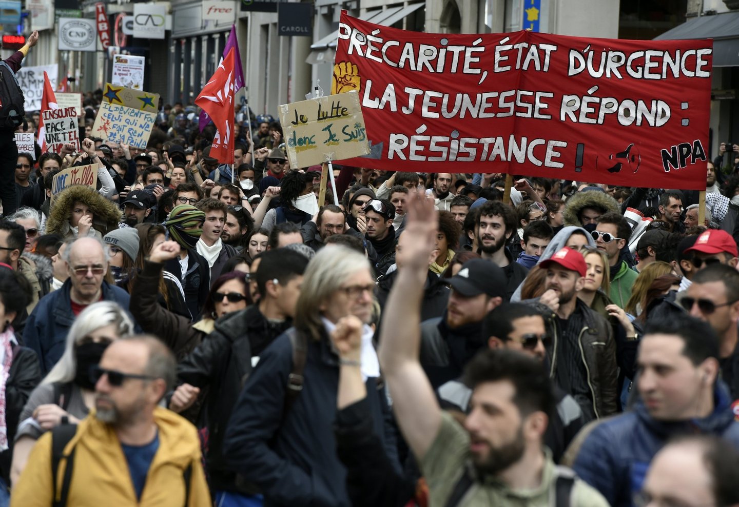 Peole demonstrate against the French government's proposed labour reforms on April 28, 2016 in Lyon, southeastern France. / AFP / PHILIPPE DESMAZES (Photo credit should read PHILIPPE DESMAZES/AFP/Getty Images)