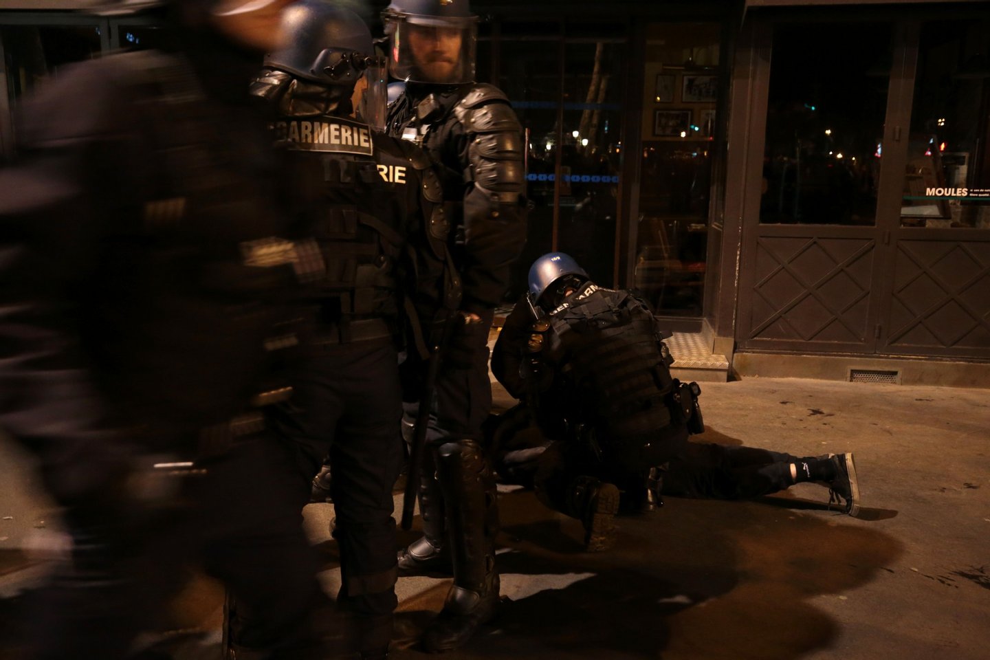 French Gendarmerie arrest a person as they clear the Place de la Republique in Paris during a protest by the Nuit Debout, or "Up All Night" movement who have been rallying against the French government's proposed labour reforms early on April 29, 2016. Twenty-seven people were arrested and 24 detained during the overnight clashes in the French capital as the police dispersed the protesters who began their began movement on March 31 in opposition to the government's proposed labour reforms. AFP PHOTO / JOEL SAGET / AFP / JOEL SAGET (Photo credit should read JOEL SAGET/AFP/Getty Images)