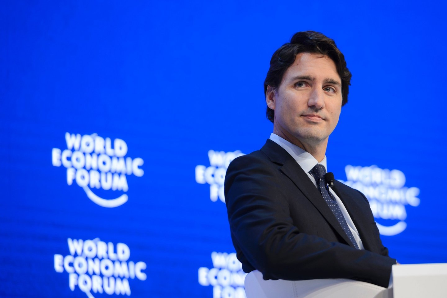 Canadian Prime Minister Justin Trudeau looks on  during a session of the World Economic Forum (WEF) annual meeting in Davos, on January 20, 2016. A string of jihadist attacks and rising risks to the global economy overshadow the opening of the annual gathering of the world's rich and powerful in a snow-blanketed Swiss ski resort. Even as heads of state, billionaires and Hollywood megastar Leonardo DiCaprio were arriving, the International Monetary Fund (IMF) sounded the alarm on January 19, 2016 about perils in the major emerging market economies and lowered its outlook for global economic growth this year. / AFP / FABRICE COFFRINI        (Photo credit should read FABRICE COFFRINI/AFP/Getty Images)
