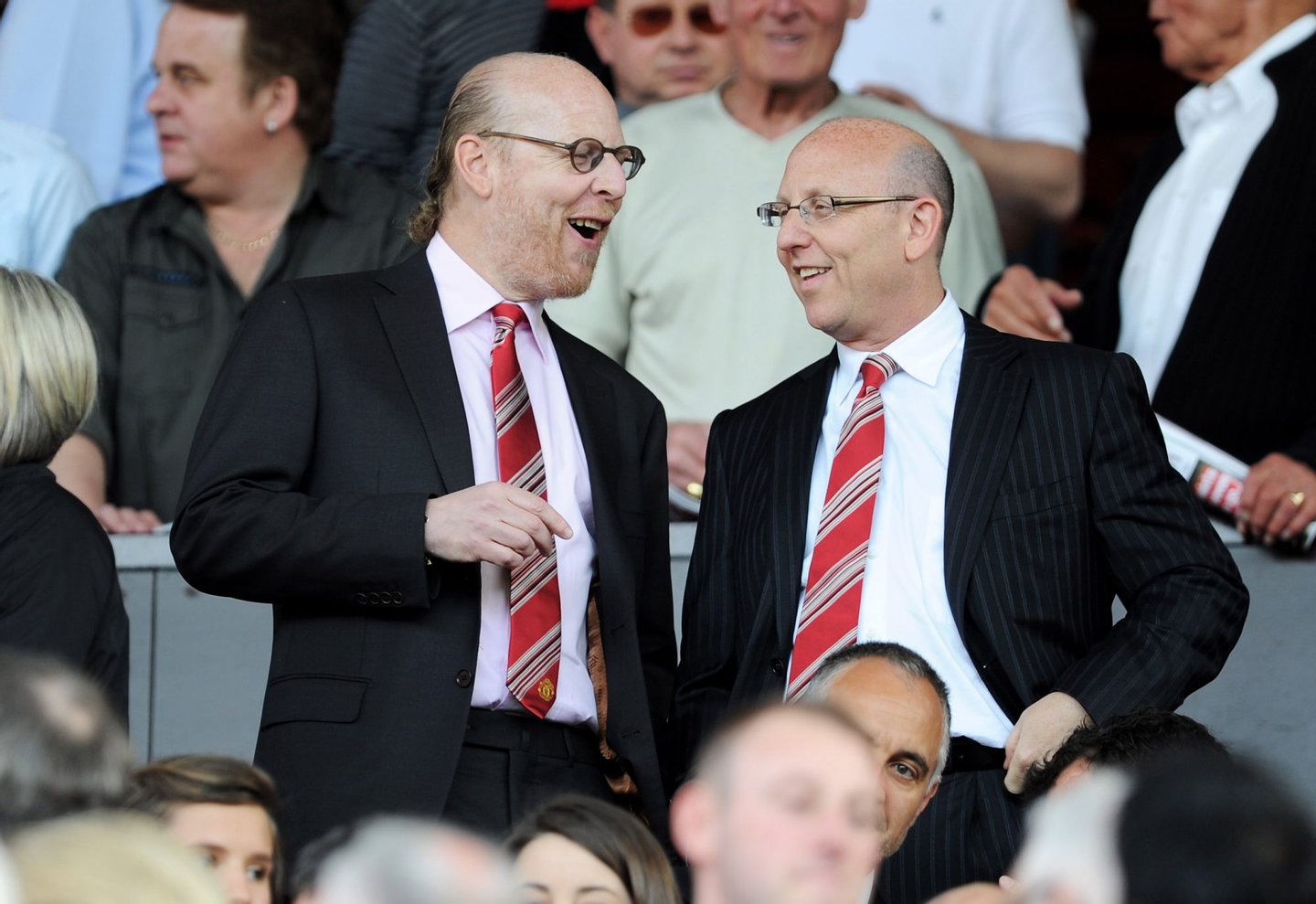 MANCHESTER, ENGLAND - APRIL 09: Manchester United Co-Chairmen Joel Glazer (R) and Avram Glazer talk during the Barclays Premier League match between Manchester United and Fulham at Old Trafford on April 9, 2011 in Manchester, England. (Photo by Michael Regan/Getty Images)