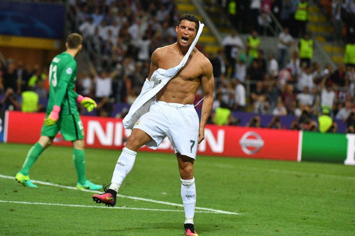 Real Madrid's Portuguese forward Cristiano Ronaldo celebrates after Real Madrid won the UEFA Champions League final football match over Atletico Madrid at San Siro Stadium in Milan, on May 28, 2016. / AFP / GERARD JULIEN        (Photo credit should read GERARD JULIEN/AFP/Getty Images)