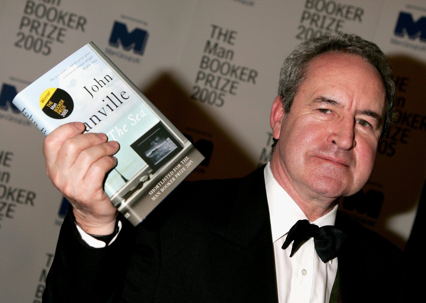 LONDON - OCTOBER 10: Author John Banville poses with his book "The Sea" which won the Man Booker Prize 2005 for novel at the Guildhall October 10, 2005 in London, England. Shortlisted novels for the 50,000-pound literary prize were: Banville's "The Sea;" "The Accidental" by Ali Smith; "Arthur & George" by Julian Barnes; "A Long Long Way" by Sebastian Barry; "Never Let Me Go" by Kazuo Ishiguro; and "On Beauty" by Zadie Smith. (Photo by Chris Jackson/Getty Images)