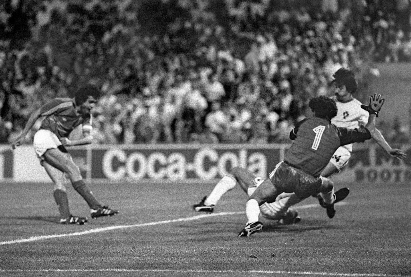 MARSEILLE, FRANCE - JUNE 23: French captain and midfielder Michel Platini scores the winning goal in extra time as Portuguese goalkeeper Bento (1) and defender Frasco dive in vain during the European Nations soccer championship semi-final match between France and Portugal, 23 June 1984 in Marseille. France beat Portugal 3-2. (Photo credit should read STAFF/AFP/Getty Images)