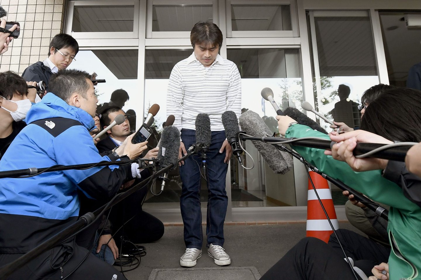 Takayuki Tanooka meets with reporters on June 3, 2016, in the northern Japan city of Hakodate, after his 7-year-old son Yamato was found safe after being left behind in mountain forests on May 28 as punishment for misbehaving. The 44-year-old father apologized for trouble he caused. (Photo by Kyodo News via Getty Images)