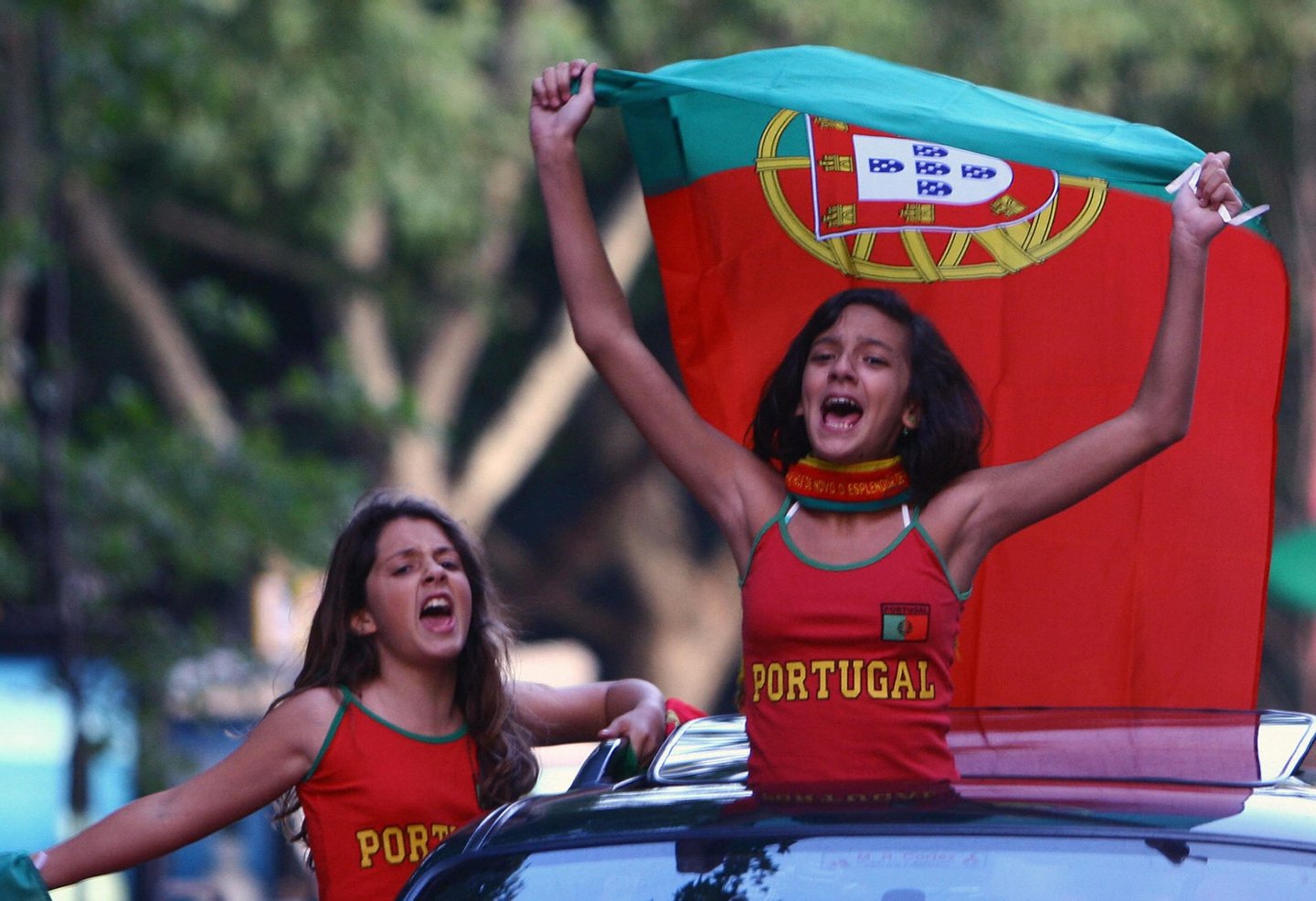 Lisbon, PORTUGAL: Portuguese fans celebrate beating England 1-4 in their World Cup 2006 quarter-final match 01 July 2006 in Lisbon. AFP PHOTO/ FRANCISCO LEONG (Photo credit should read FRANCISCO LEONG/AFP/Getty Images)