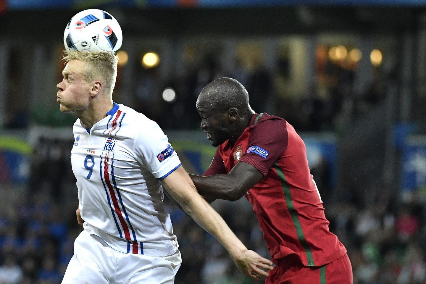 Iceland's forward Kolbeinn Sigthorsson is tackled by Portugal's midfielder Danilo Pereira during the Euro 2016 group F football match between Portugal and Iceland at the Geoffroy-Guichard stadium in Saint-Etienne on June 14, 2016. / AFP / jeff pachoud (Photo credit should read JEFF PACHOUD/AFP/Getty Images)