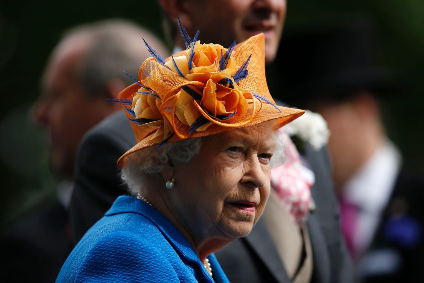 Britain's Queen Elizabeth II looks on during the presentation ceremony for the Gold Cup during Ladies' day at Royal Ascot horse racing meet in Ascot, west of London on June 16, 2016. The five-day meeting is one of the highlights of the horse racing calendar. Horse racing has been held at the famous Berkshire course since 1711 and tradition is a hallmark of the meeting. Top hats and tails remain compulsory in parts of the course while a daily procession of horse-drawn carriages brings the Queen to the course. / AFP / ADRIAN DENNIS (Photo credit should read ADRIAN DENNIS/AFP/Getty Images)