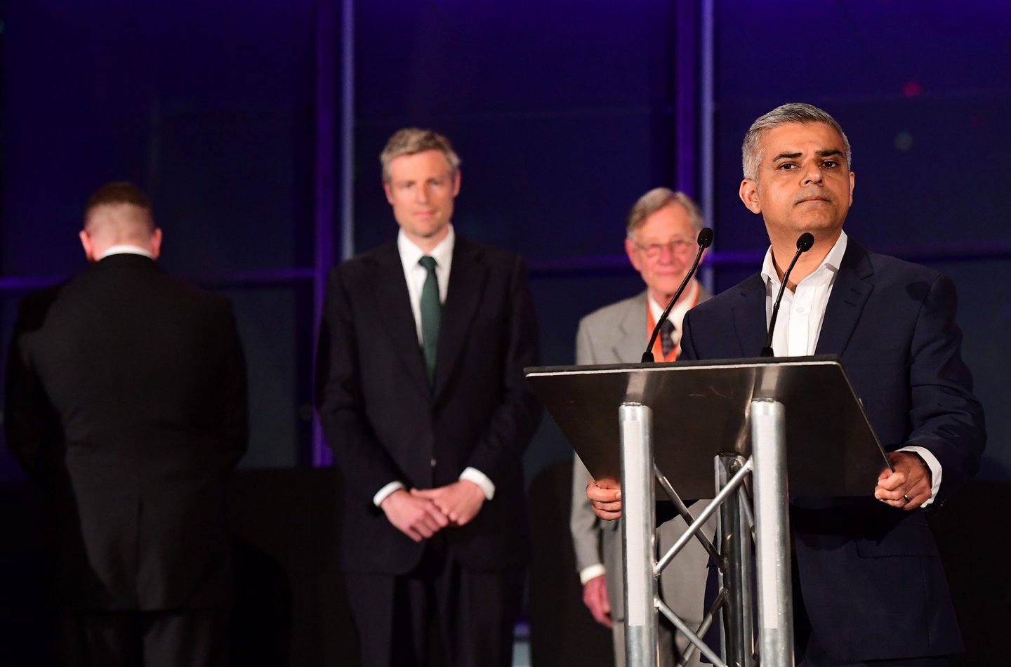 London's new Mayor Sadiq Khan (R) addresses the media as Paul Golding (Far L) the candidate for Britain First, turns his back during the address at City Hall in central London on May 7, 2016. London became the first EU capital with a Muslim mayor Friday as Sadiq Khan won the election that saw his opposition Labour party suffer nationwide setbacks. / AFP / LEON NEAL (Photo credit should read LEON NEAL/AFP/Getty Images)