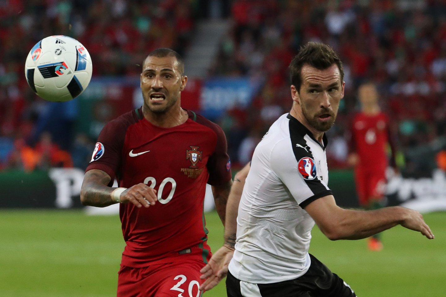 Portugal's forward Ricardo Quaresma (L) vies with Austria's defender Christian Fuchs during the Euro 2016 group F football match between Portugal and Austria at the Parc des Princes in Paris on June 18, 2016. / AFP / KENZO TRIBOUILLARD (Photo credit should read KENZO TRIBOUILLARD/AFP/Getty Images)