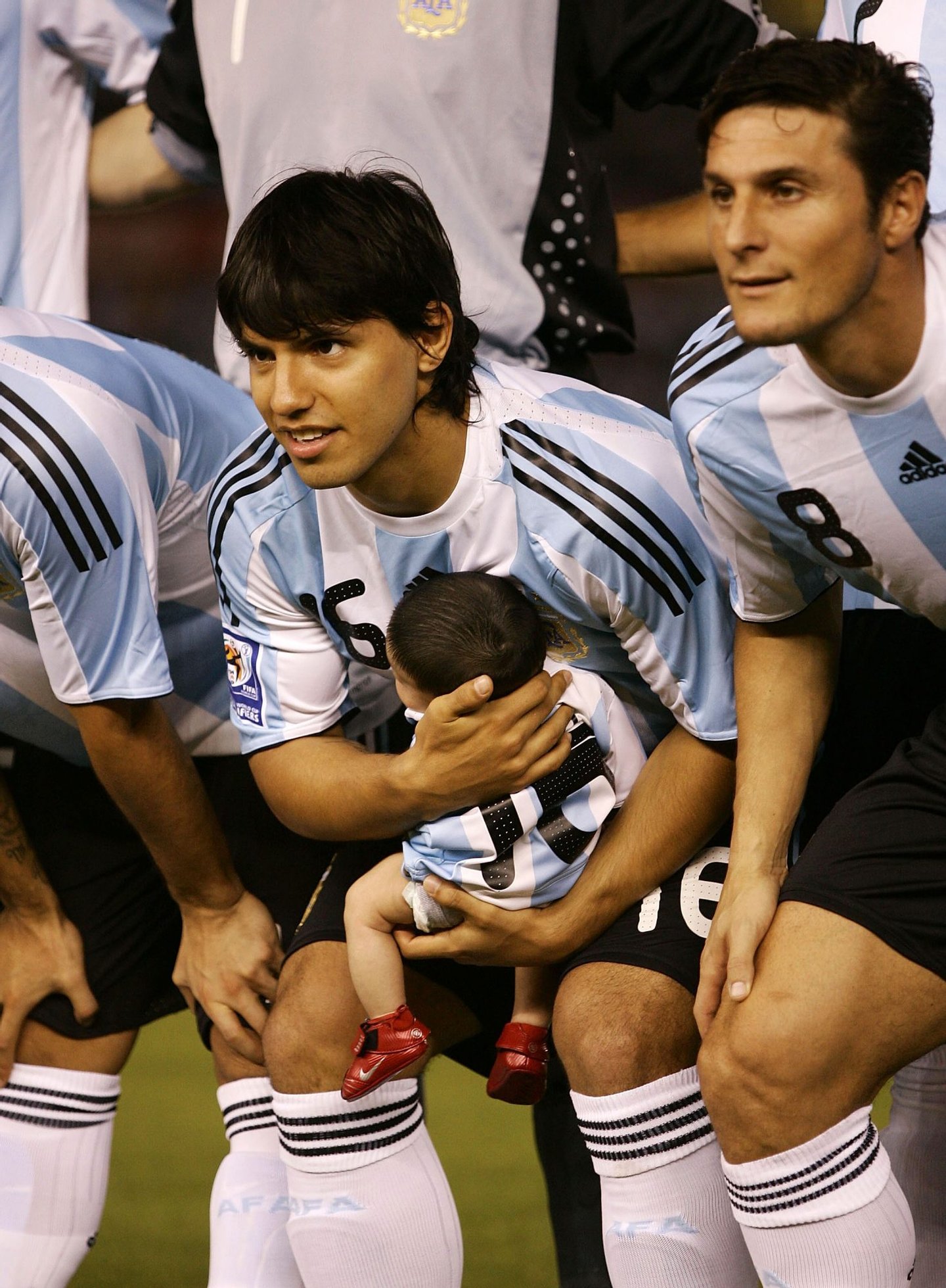 BUENOS AIRES, ARGENTINA - MARCH 28: Sergio Aguero of Argentina poses for photographs with his son Benjamin prior to the 2010 FIFA World Cup South African qualifier match between Argentina and Venezuela at River Plate Stadium on March 28, 2009 in Buenos Aires, Argentina. (Photo by Photogamma/Getty Images)