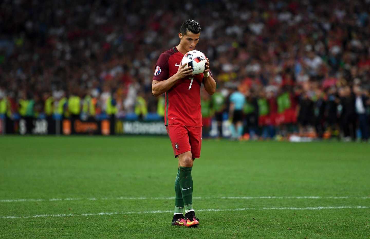 MARSEILLE, FRANCE - JUNE 30: Cristiano Ronaldo of Portugal kisses the ball at the penalty shootout during the UEFA EURO 2016 quarter final match between Poland and Portugal at Stade Velodrome on June 30, 2016 in Marseille, France. (Photo by Laurence Griffiths/Getty Images)