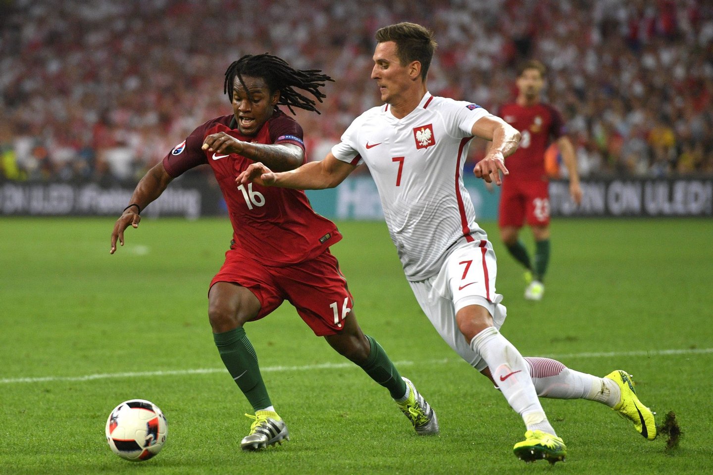 Portugal's midfielder Renato Sanches (L) vies with Poland's forward Arkadiusz Milik during the Euro 2016 quarter-final football match between Poland and Portugal at the Stade Velodrome in Marseille on June 30, 2016. / AFP / Francisco LEONG (Photo credit should read FRANCISCO LEONG/AFP/Getty Images)