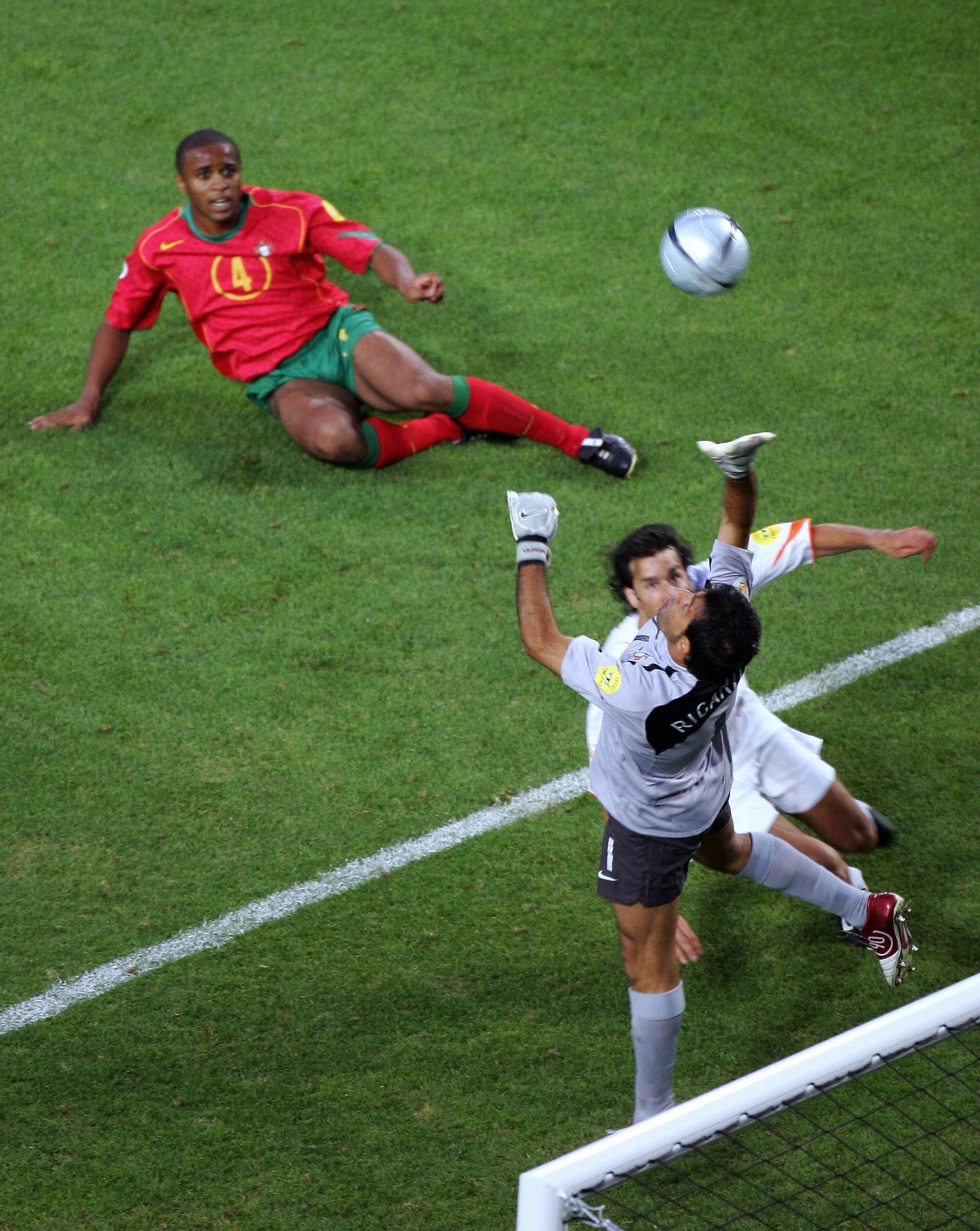 LISBON, Portugal: Portuguese goalkeeper Ricardo (R) fails to grab the own goal of Portuguese defender Jorge Andrade (top) as Dutch forward Ruud Van Nistelrooy (R) looks on, 30 June 2004 during their European Nations championship semi-final football match between Portugal and the Netherlands at the Jose Alvalade stadium in Lisbon.AFP PHOTO Francois Xavier MARIT (Photo credit should read FRANCOIS XAVIER MARIT/AFP/Getty Images)