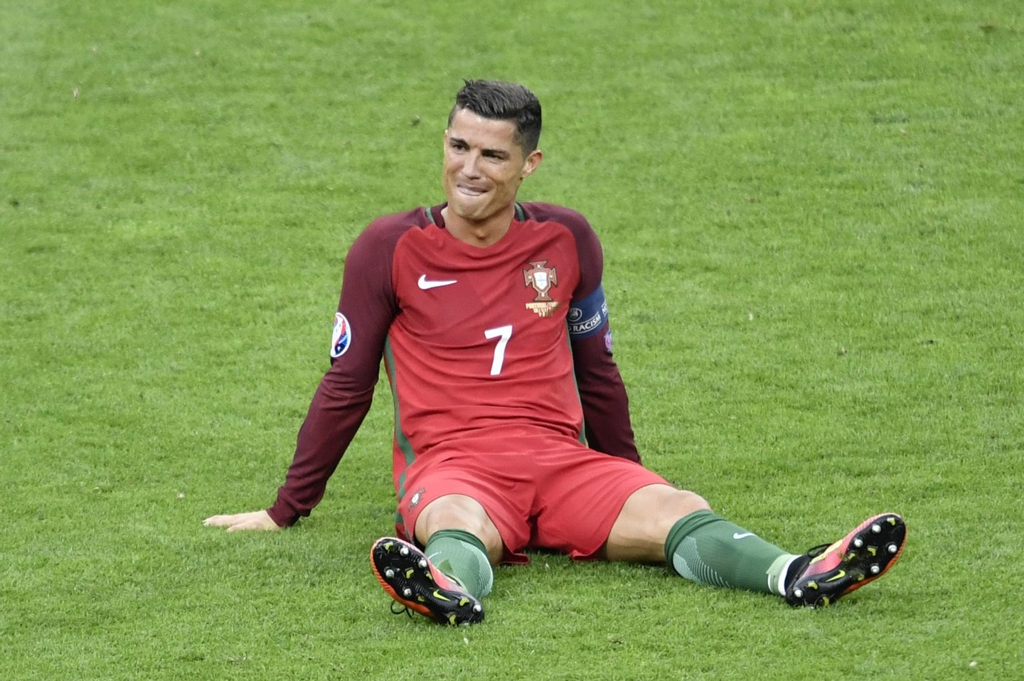 Portugal's forward Cristiano Ronaldo reacts after an injury following a clash with France's forward Dimitri Payet (not pictured) during the Euro 2016 final football match between Portugal and France at the Stade de France in Saint-Denis, north of Paris, on July 10, 2016. / AFP / PHILIPPE LOPEZ (Photo credit should read PHILIPPE LOPEZ/AFP/Getty Images)