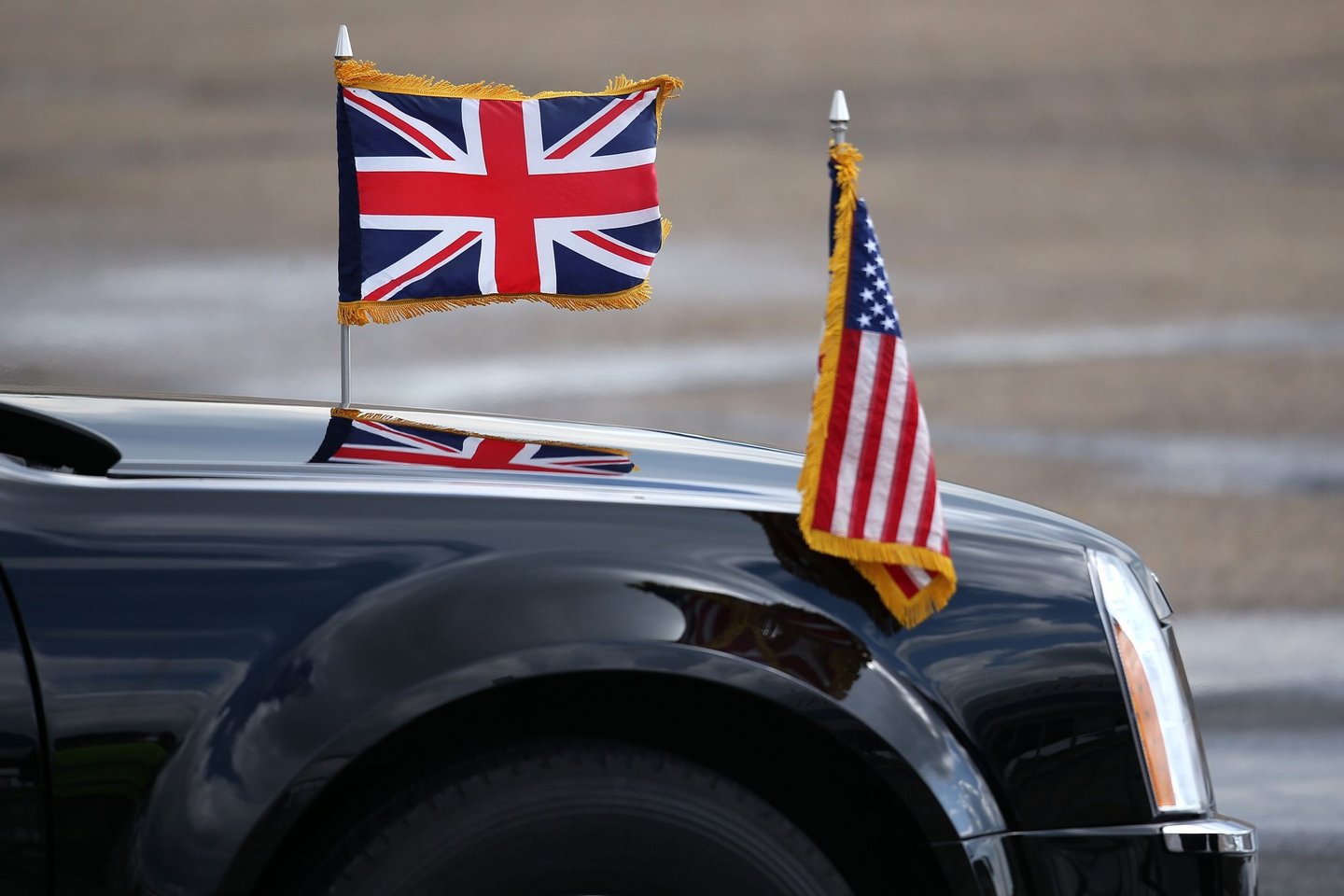 LONDON, ENGLAND - APRIL 24: The British and US flags fly from the bonnet of a car prior to the departure of US President Barack Obama at Stansted Airport, on April 24, 2016 in London, England. Mr Obama is to visit Hanover in Germany to hold talks with German Chancellor Angela Merkel before returning to the US. (Photo by Dan Kitwood/Getty Images)