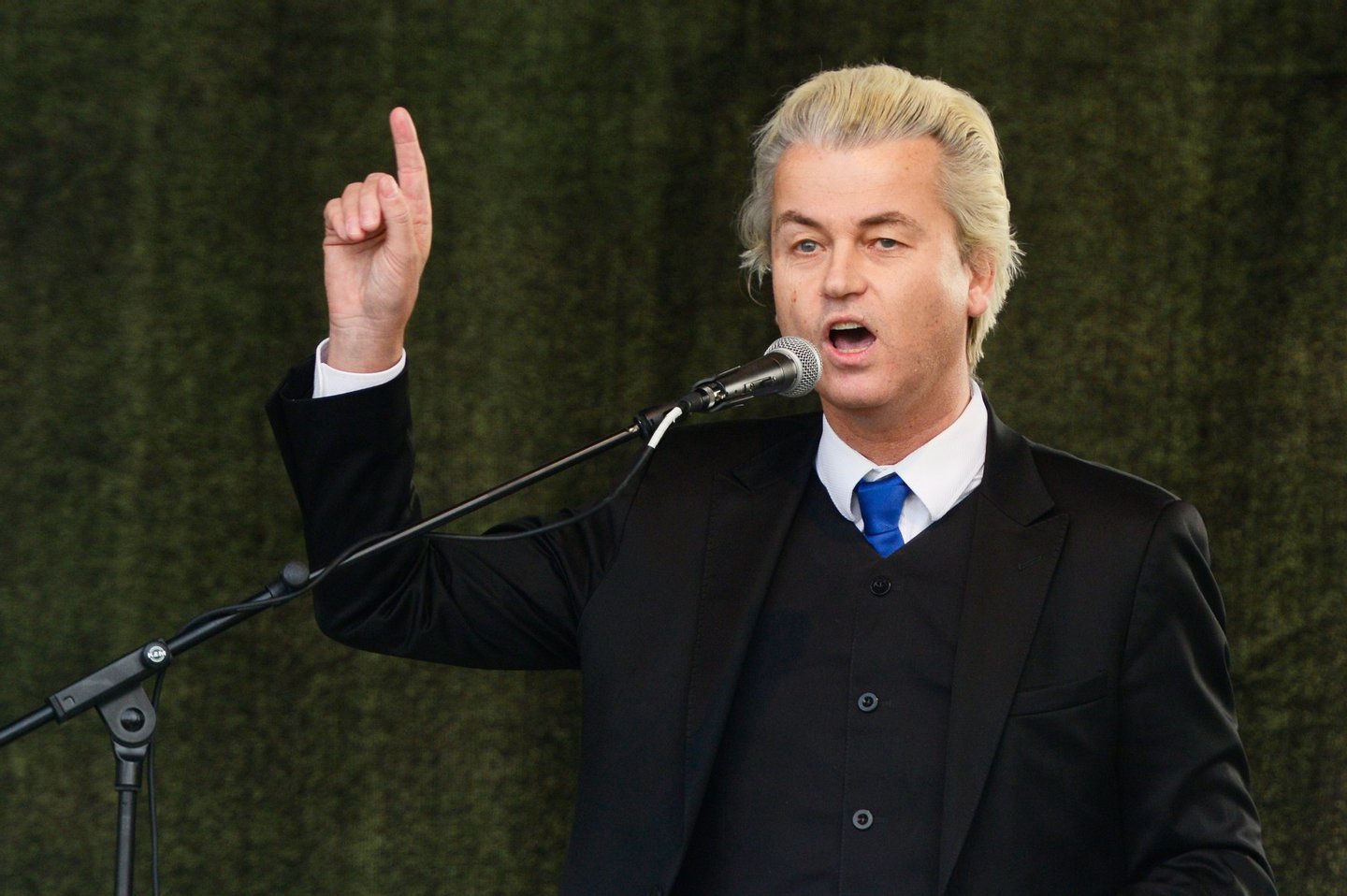 Dutch right-wing Party for Freedom (PVV) leader Geert Wilders (R) addresses a rally of German right-wing movement PEGIDA (Patriotic Europeans Against the Islamisation of the Occident) on April 13, 2015 in Dresden, south-eastern Germany. The PEGIDA marches -- which have voiced anger against Islam and "criminal asylum seekers" and vented a host of other grievances -- began in Dresden in October 2014 with several hundred supporters and have since steadily grown. (Photo credit should read ROBERT MICHAEL/AFP/Getty Images)