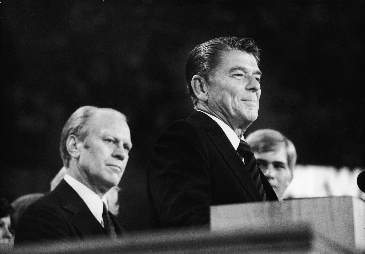 American president Gerald Ford (left) listens as future American president Ronald Reagan (1911 - 2004) delivers a speech during the closing session of the Republican National Convention, Kansas City, Missouri, August 19, 1976. (Photo by Hulton Archive/Getty Images)