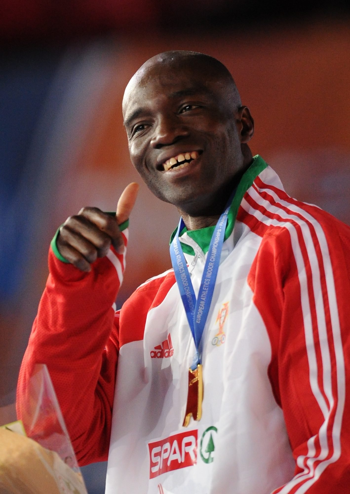 Portugal's Francis Obikwelu poses on the podium with his gold medal after the men's 60m final during the European athletics indoor championships on March 6, 2011 at the Bercy Palais-Omnisport (POPB) in Paris. Obikwelu arrived first ahead of Chambers and Lemaitre. AFP PHOTO / FRANCK FIFE (Photo credit should read FRANCK FIFE/AFP/Getty Images)