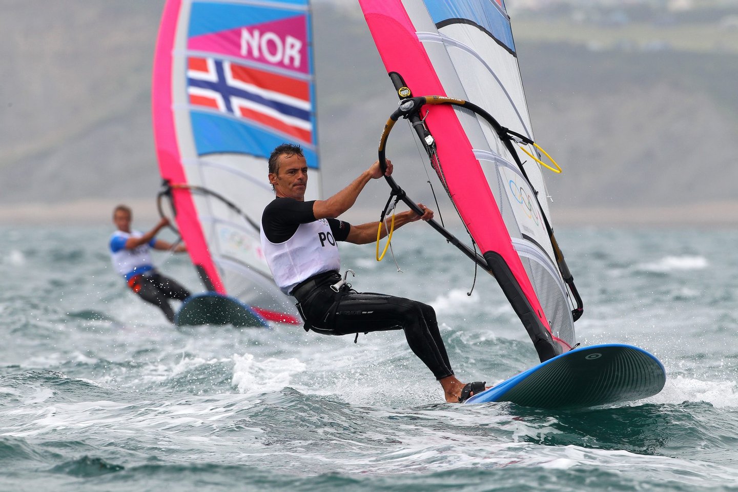 WEYMOUTH, ENGLAND - JULY 31: Joao Rodrigues of Portugal competes in the Men's RS:X Sailing on Day 4 of the London 2012 Olympic Games at the Weymouth & Portland Venue at Weymouth Harbour on July 31, 2012 in Weymouth, England. (Photo by Richard Langdon/Getty Images)