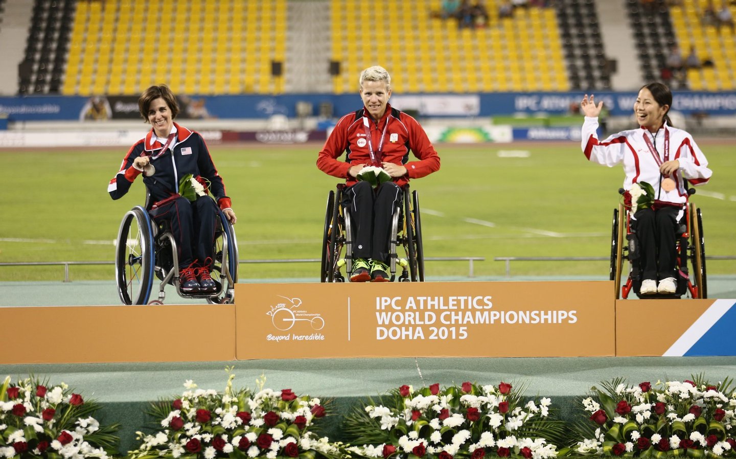 DOHA, QATAR - OCTOBER 26: Marieke Vervoort of Belgium poses with her gold medal, Kerry Morgan of USA silver and Yuka Kiyama of Japan bronze after the women's 100m T52 final during the Evening Session on Day Five of the IPC Athletics World Championships at Suhaim Bin Hamad Stadium on October 26, 2015 in Doha, Qatar. (Photo by Warren Little/Getty Images)