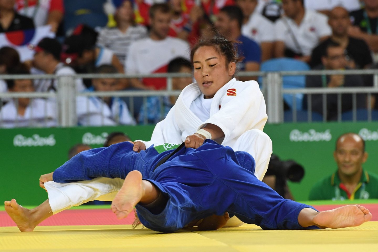 Mongolia's Sumiya Dorjsuren (white) competes with Portugal's Telma Monteiro during their women's -57kg judo contest quarterfinal match of the Rio 2016 Olympic Games in Rio de Janeiro on August 8, 2016. / AFP / Toshifumi KITAMURA (Photo credit should read TOSHIFUMI KITAMURA/AFP/Getty Images)