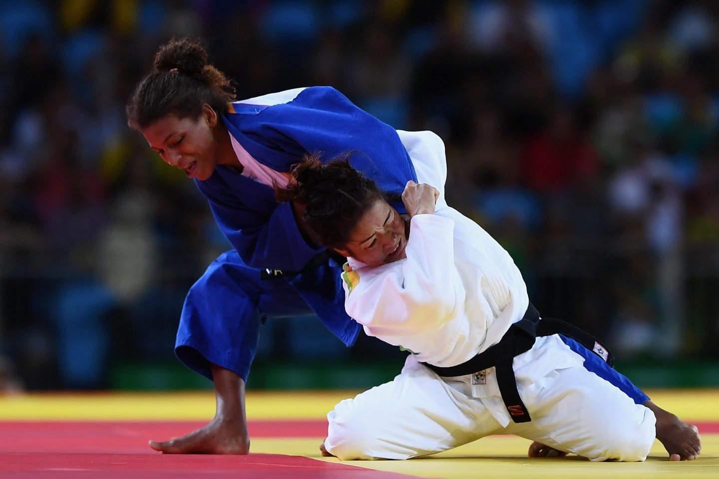 RIO DE JANEIRO, BRAZIL - AUGUST 08: Rafaela Silva of Brazil (blue) competes against Sumiya Dorjsuren of Mongolia in the Women's -57 kg Final - Gold Medal Contest on Day 3 of the Rio 2016 Olympic Games at Carioca Arena 2 on August 8, 2016 in Rio de Janeiro, Brazil. (Photo by David Ramos/Getty Images)