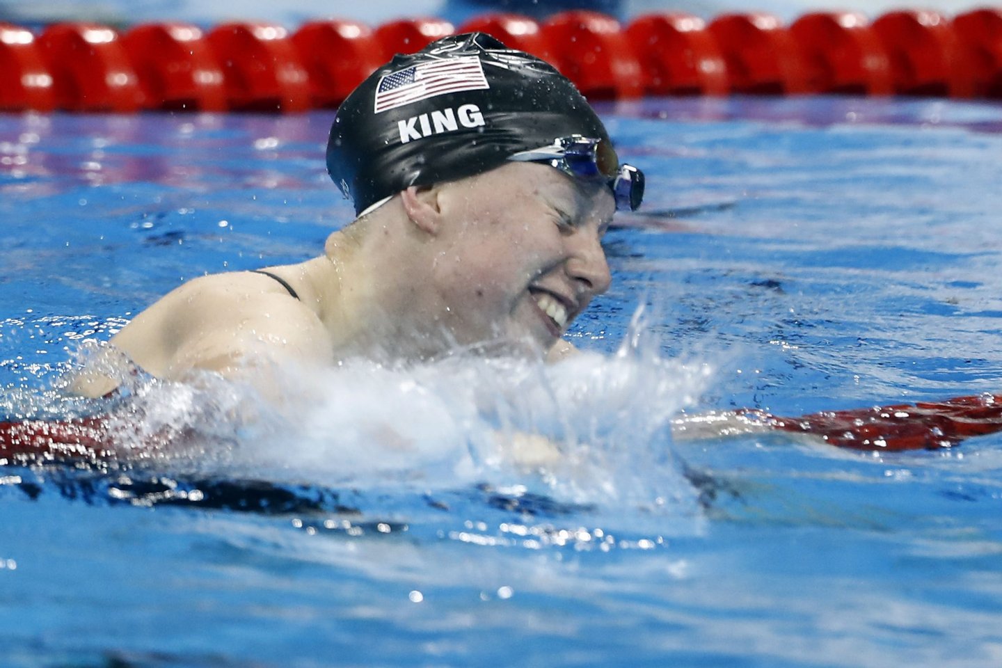 USA's Lilly King celebrates after she broke the Olympic record to win the Women's 100m Breaststroke Final during the swimming event at the Rio 2016 Olympic Games at the Olympic Aquatics Stadium in Rio de Janeiro on August 8, 2016. / AFP / Odd Andersen (Photo credit should read ODD ANDERSEN/AFP/Getty Images)