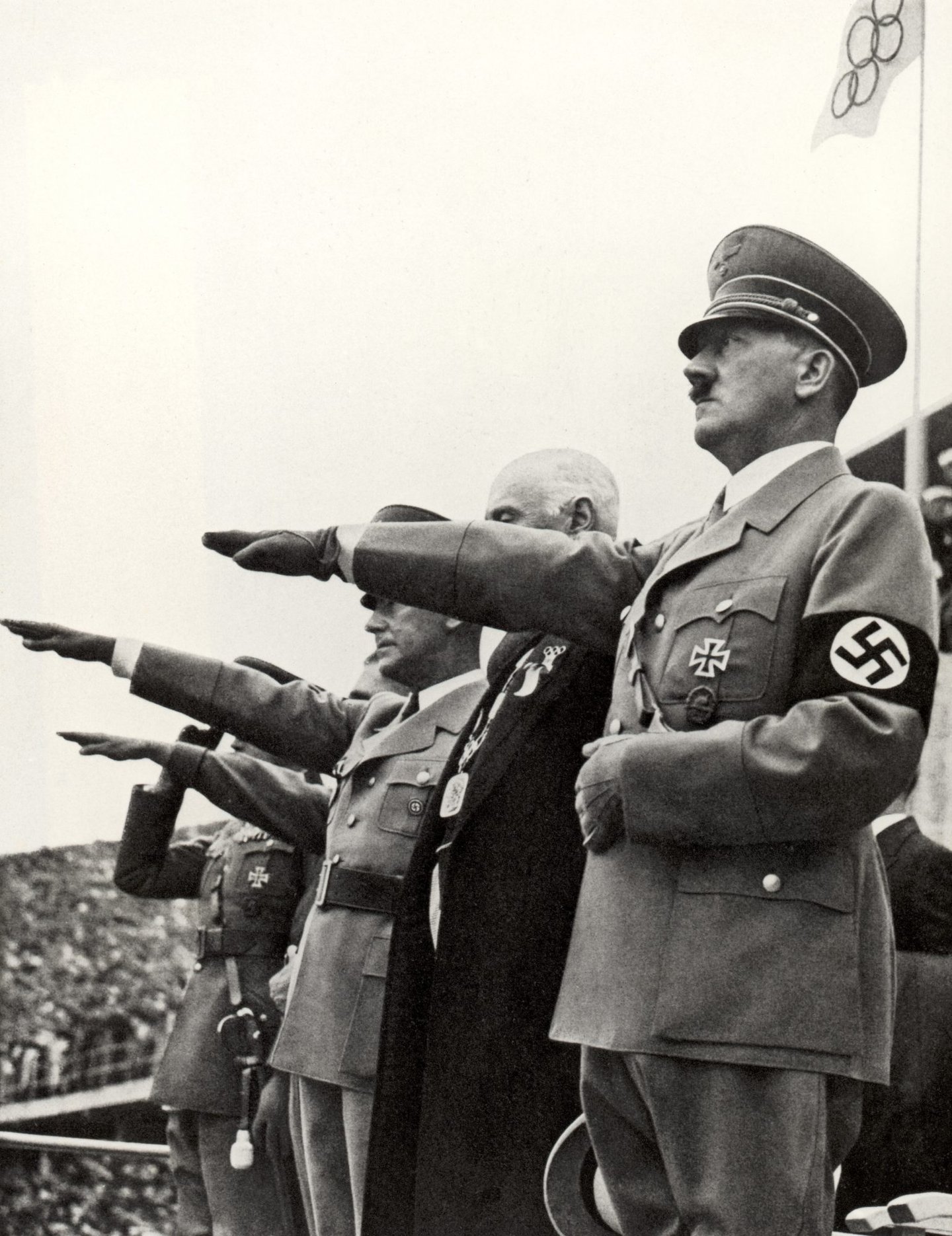 BERLIN - AUGUST 1: Adolf Hitler and his staff salute the teams during the opening ceremonies of the XI Olympic Games on August 1, 936 in Berlin, Germany. (Photo by Getty Images)