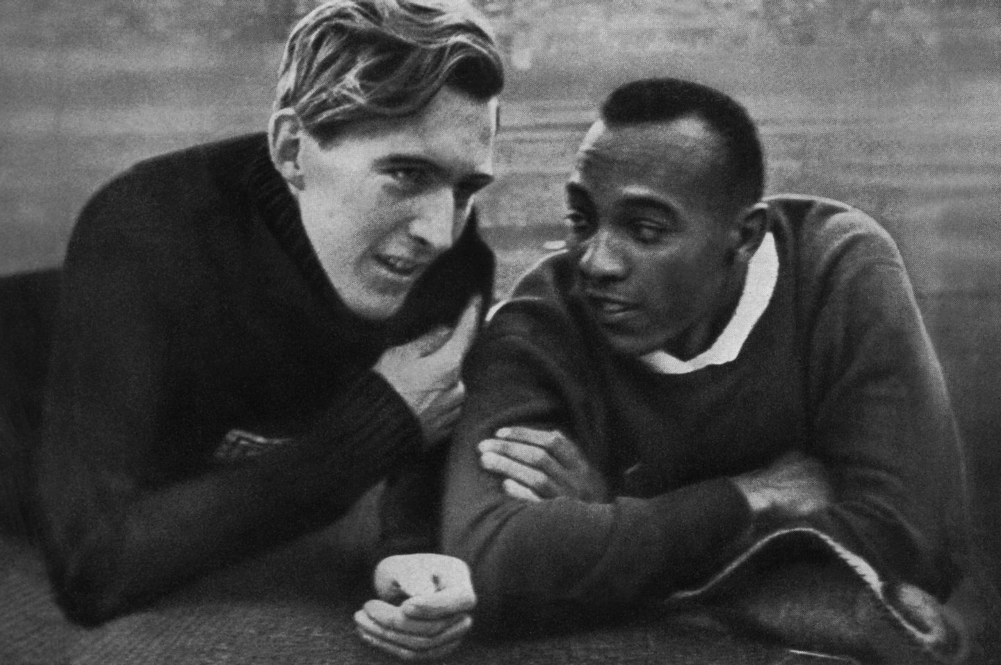 US champion Jesse Owens (R) and German champion Luz Long (L) chat together on the Berlin stadium 01 August 1936 during the Olympic Games where Owens captured 4 gold medals, 100m, 200m, 4x100m and long jump. Luz, second of Owens, captured the long jump silver. Grandson of a slave and legendary athlete, "Jesse" Owens established 6 world records in 1935. "Jesse" Owens retained his 100m world record for 20 years and his long jump world record for 25 years (until 1960). (Photo credit should read CORR/AFP/Getty Images)