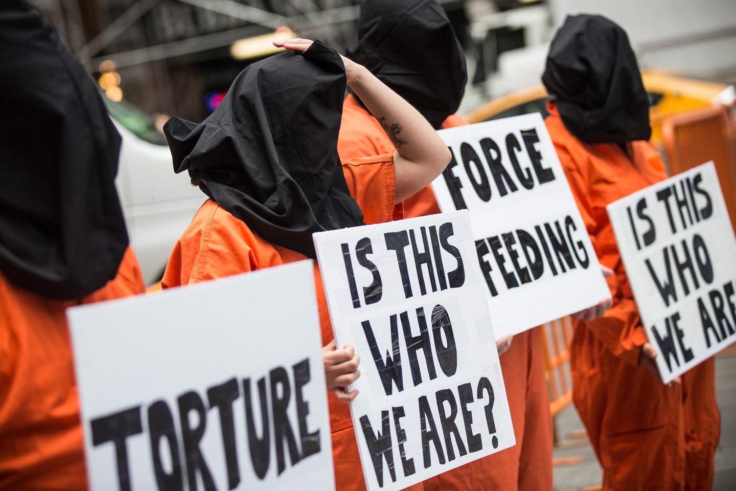 NEW YORK, NY - MAY 23: Protestors demand the closure of the Guantanamo Bay detention center, used by U.S. military forces to hold people indefinitely, in Times Square on May 23, 2014 in New York City. Organizers of the protest claimed the gathering was in coordination with protests happening in 40 other cities. (Photo by Andrew Burton/Getty Images)