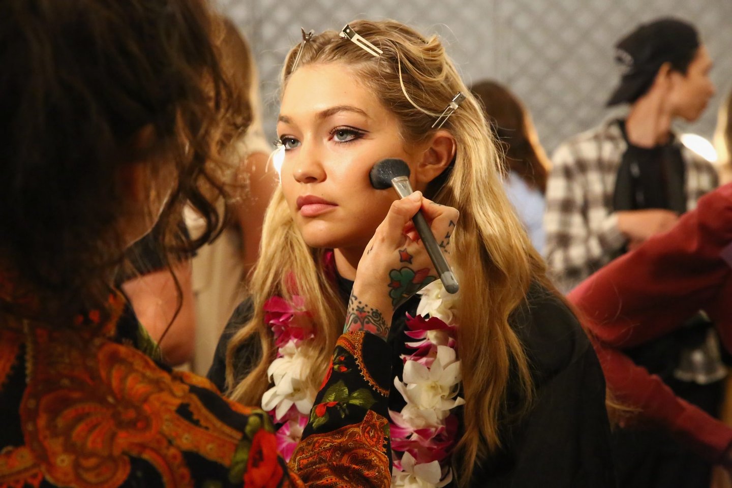 NEW YORK, NY - SEPTEMBER 16: Makeup artist Erin Parsons (L) and model Gigi Hadid is prepared backstage at Anna Su Spring 2016 during New York Fashion Week: The Shows at The Arc, Skylight at Moynihan Station on September 16, 2015 in New York City. (Photo by Astrid Stawiarz/Getty Images for NYFW: The Shows)