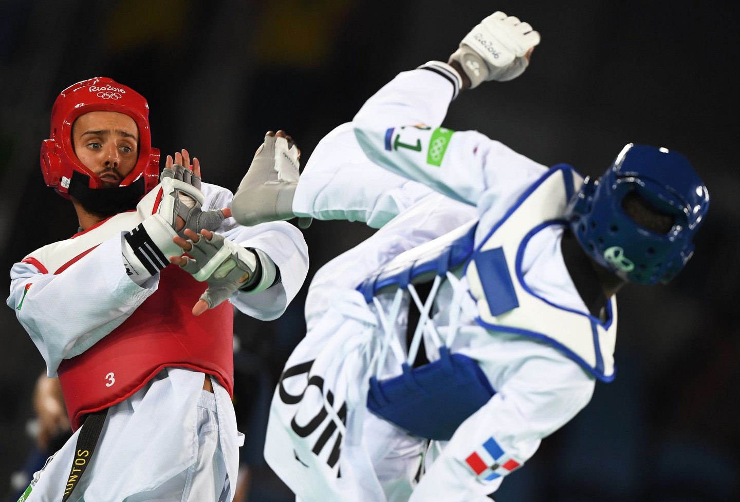 Portugal's Rui Braganca (L) competes against Dominican Republic's Luisito Pie during their men's taekwondo quarter-final bout in the -68kg category as part of the Rio 2016 Olympic Games, on August 18, 2016, at the Carioca Arena 3, in Rio de Janeiro. / AFP / Kirill KUDRYAVTSEV (Photo credit should read KIRILL KUDRYAVTSEV/AFP/Getty Images)