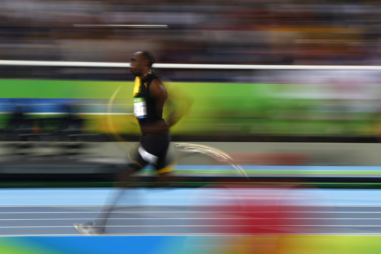 Jamaica's Usain Bolt competes in the Men's 4x100m Relay Final during the athletics event at the Rio 2016 Olympic Games at the Olympic Stadium in Rio de Janeiro on August 19, 2016. / AFP / Adrian DENNIS (Photo credit should read ADRIAN DENNIS/AFP/Getty Images)